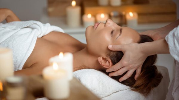 Woman getting a massage with aromatherapy