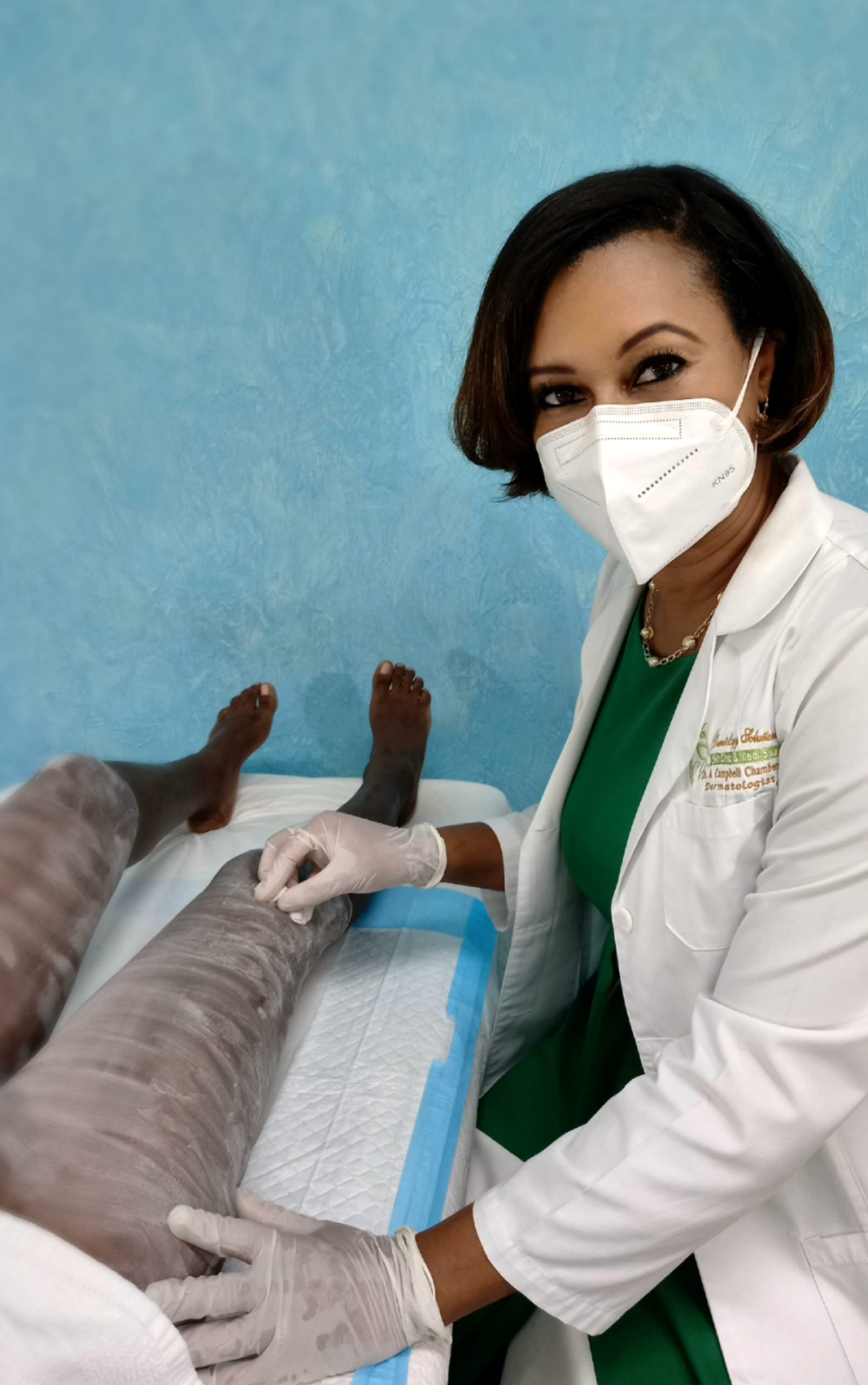 Dermatology Solutions Dr. Campbell-Chambers performing a chemical peel in our Treatment Room
