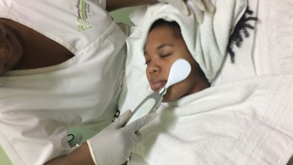 Woman receiving multiderm-microdermabrasion-treatment.