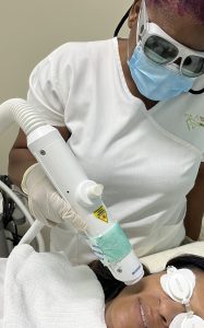 Dermatology-Solutions-laser-treatment-being-performed-on-Dr.-Arusha-Campbell-Chamber